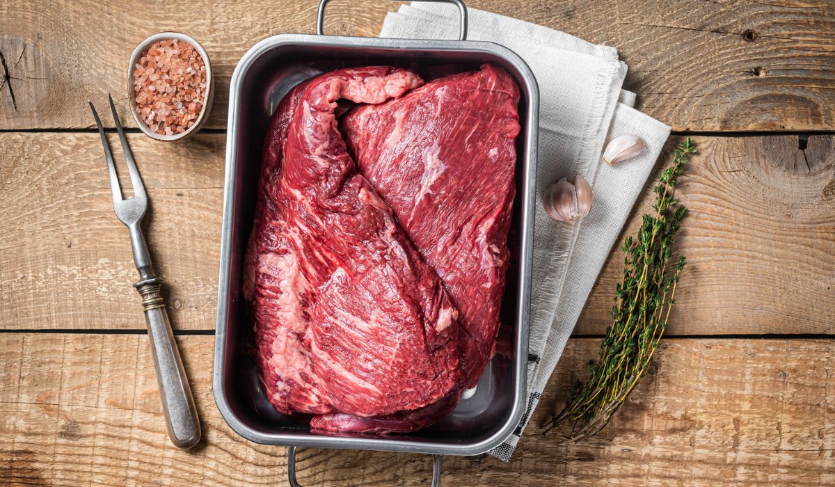Tri Tip beef steak in steel tray