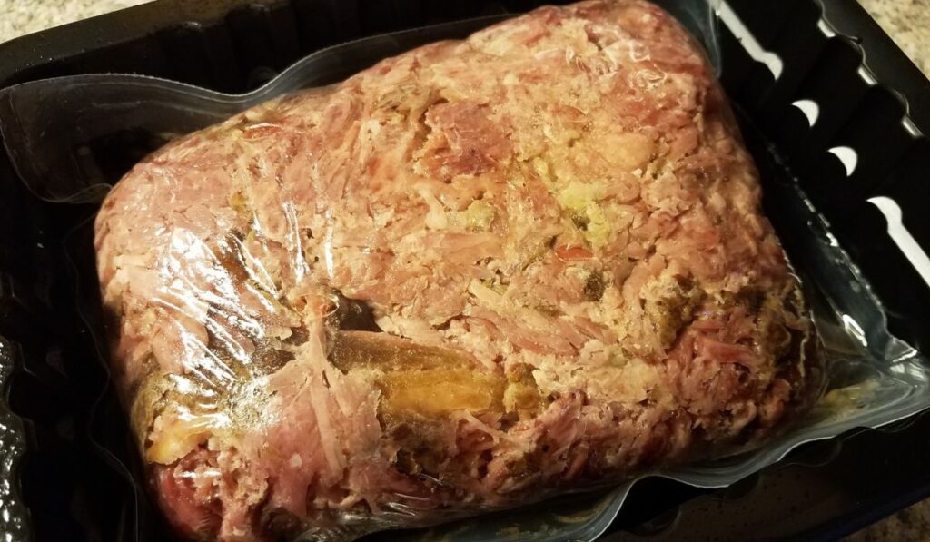 Bag of pulled pork meat in container